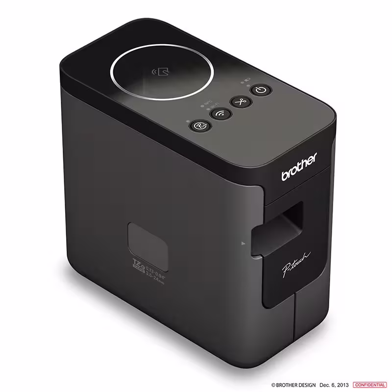 Brother PT-P750W label maker on office desk with laptop and accessories